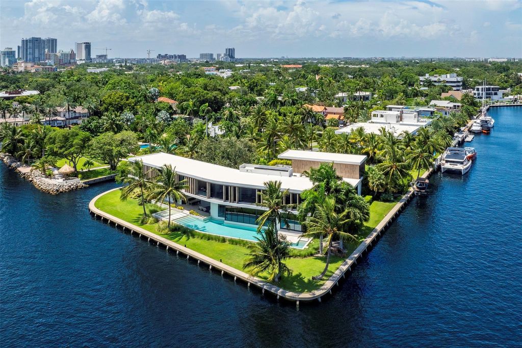 Experience unmatched luxury at 516 Mola Ave, a gated peninsula estate designed by Max Strang and built by Bomar Builders.