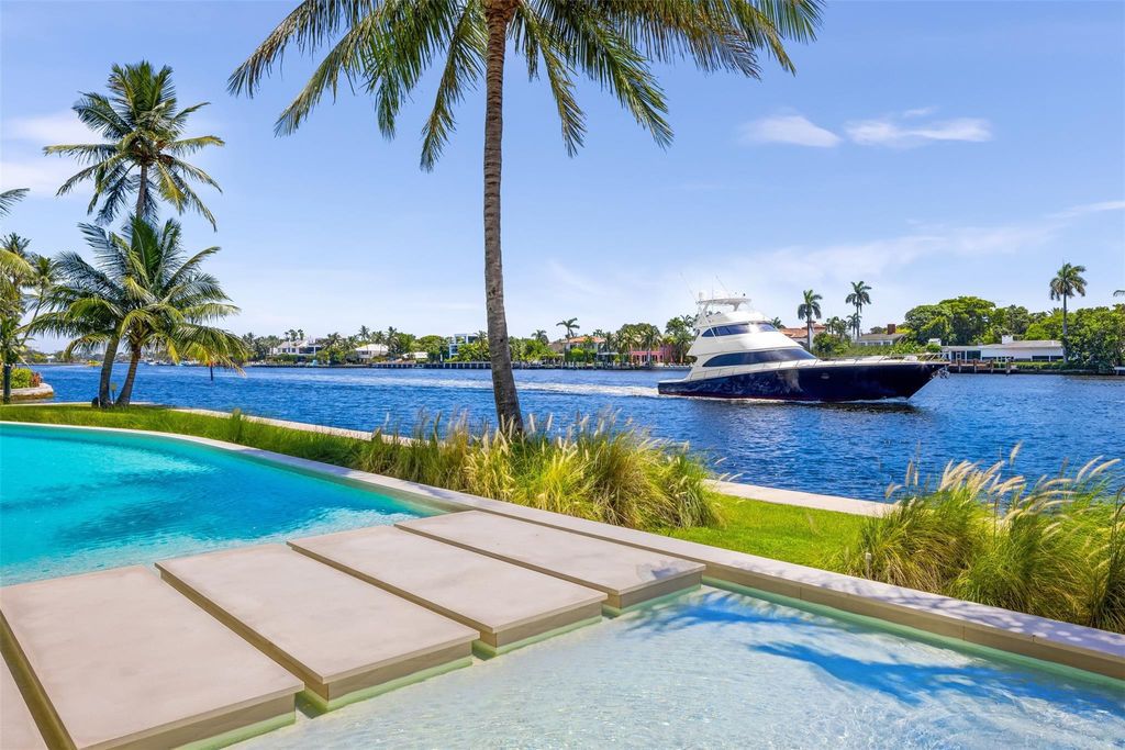 Experience unmatched luxury at 516 Mola Ave, a gated peninsula estate designed by Max Strang and built by Bomar Builders.