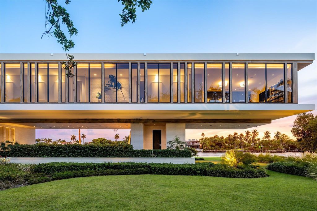 Experience unmatched luxury at 516 Mola Ave, a gated peninsula estate designed by Max Strang and built by Bomar Builders.