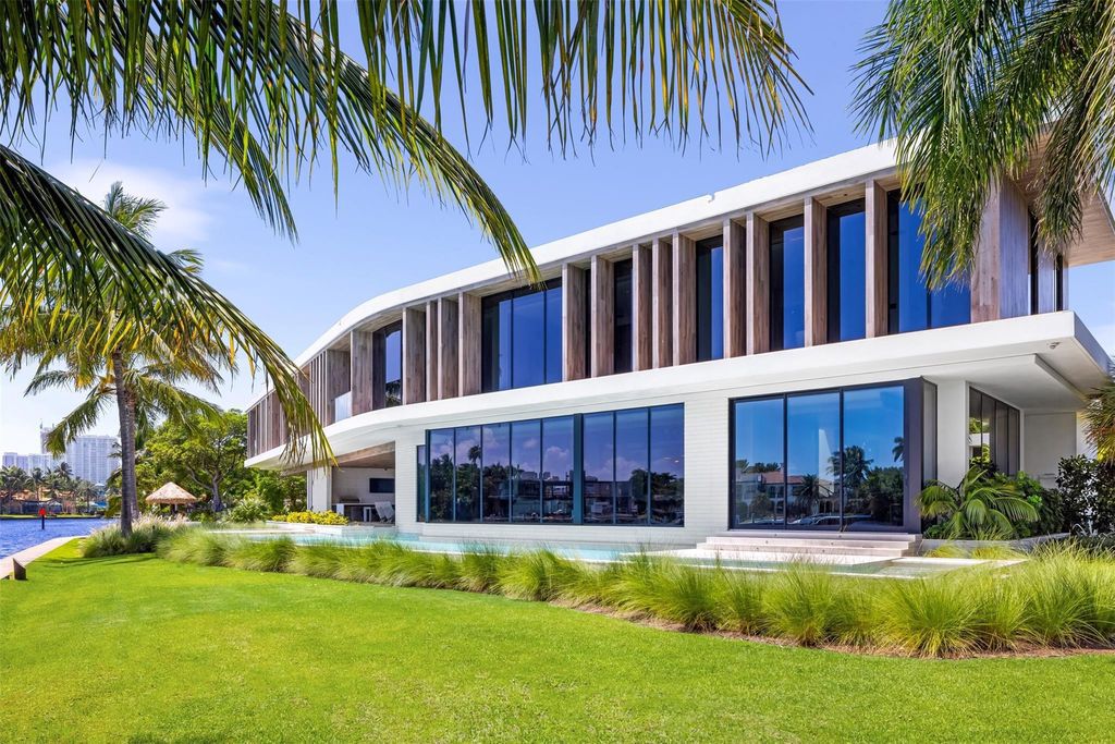 Experience unmatched luxury at 516 Mola Ave, a gated peninsula estate designed by Max Strang and built by Bomar Builders.