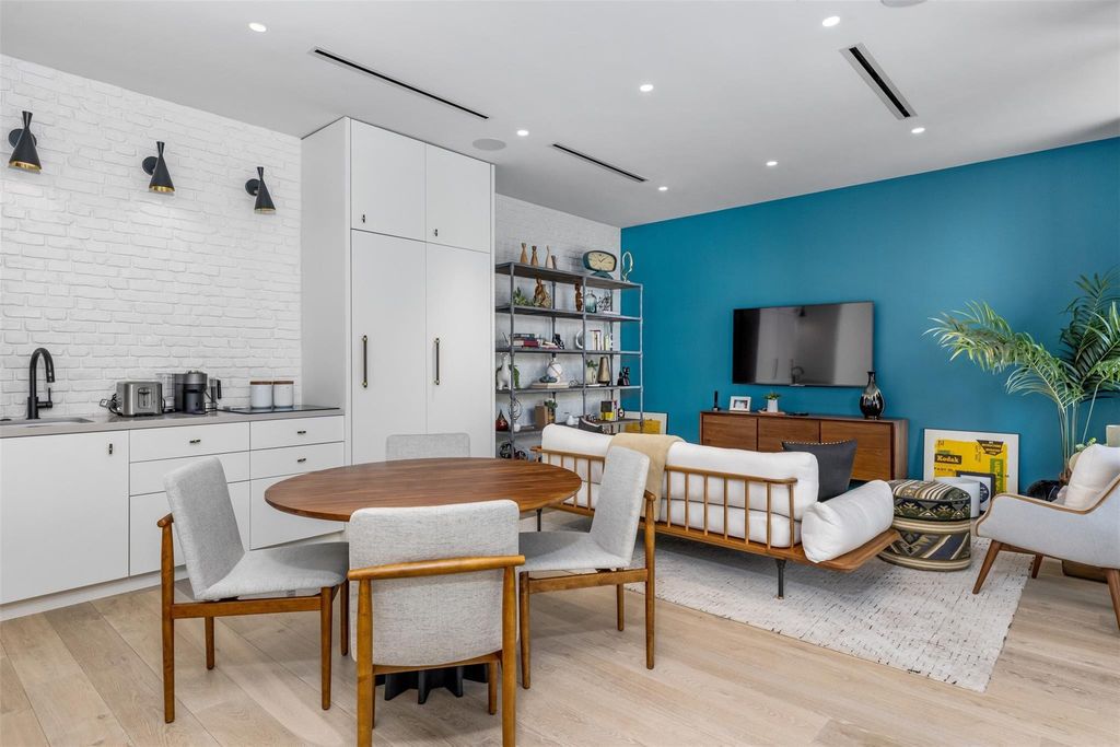 Experience unmatched luxury at 516 Mola Ave, a gated peninsula estate designed by Max Strang and built by Bomar Builders.