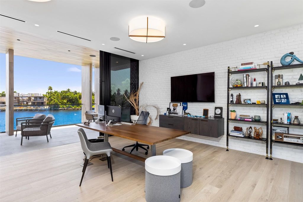 Experience unmatched luxury at 516 Mola Ave, a gated peninsula estate designed by Max Strang and built by Bomar Builders.