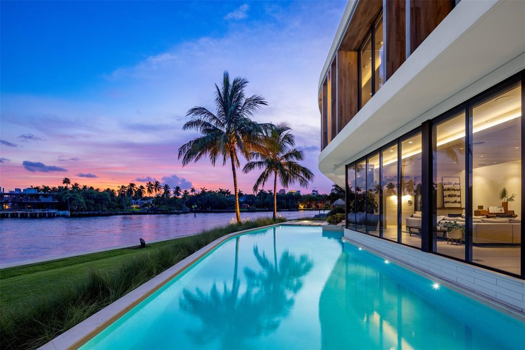 Experience unmatched luxury at 516 Mola Ave, a gated peninsula estate designed by Max Strang and built by Bomar Builders.