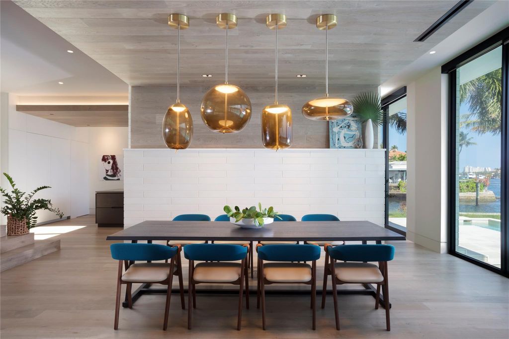 Experience unmatched luxury at 516 Mola Ave, a gated peninsula estate designed by Max Strang and built by Bomar Builders.