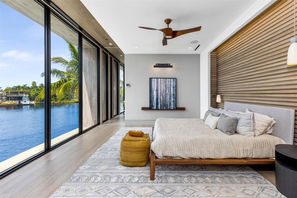 Experience unmatched luxury at 516 Mola Ave, a gated peninsula estate designed by Max Strang and built by Bomar Builders.