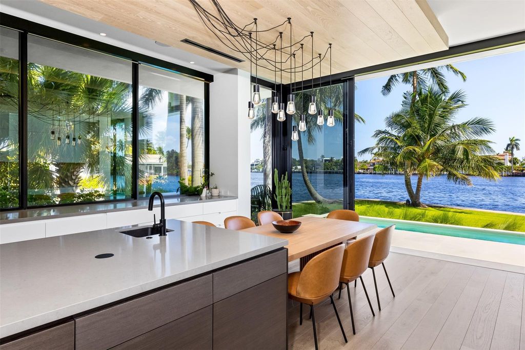 Experience unmatched luxury at 516 Mola Ave, a gated peninsula estate designed by Max Strang and built by Bomar Builders.