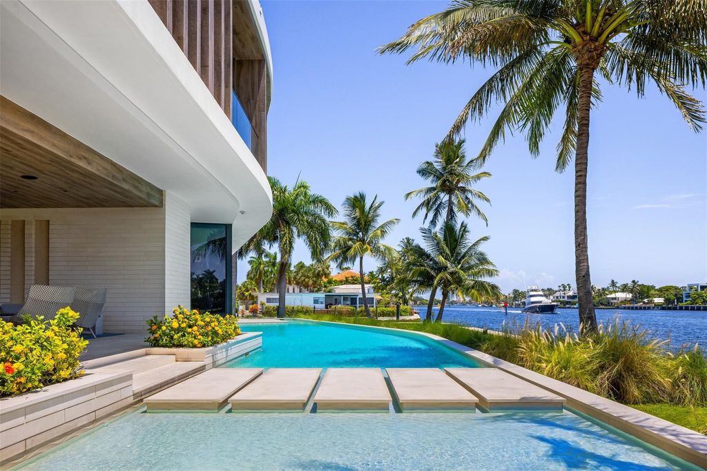Experience unmatched luxury at 516 Mola Ave, a gated peninsula estate designed by Max Strang and built by Bomar Builders.
