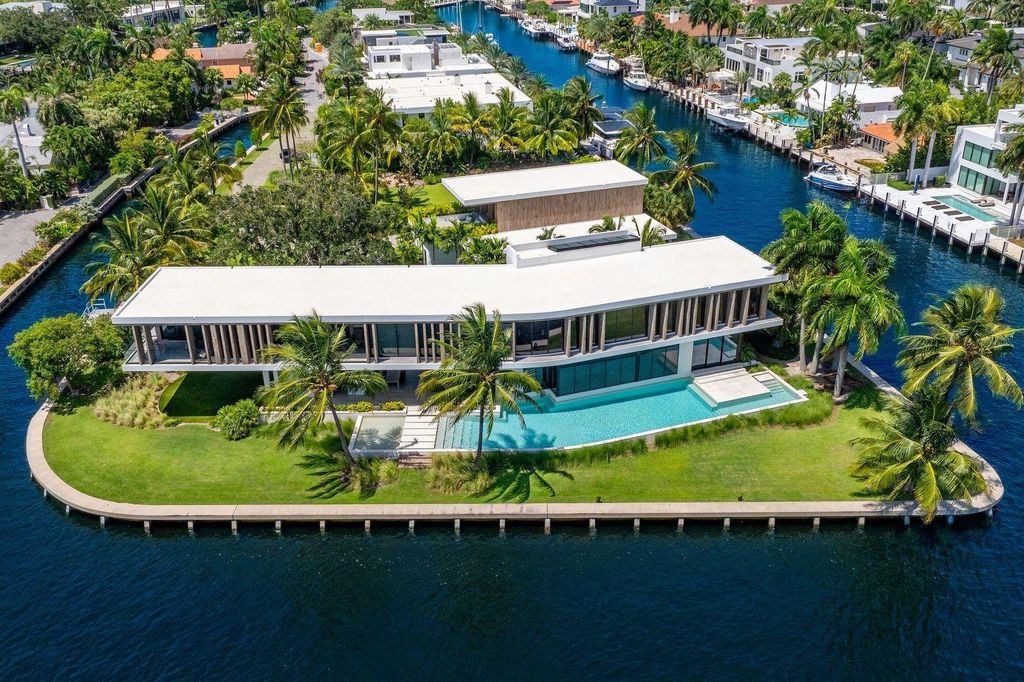 Experience unmatched luxury at 516 Mola Ave, a gated peninsula estate designed by Max Strang and built by Bomar Builders.