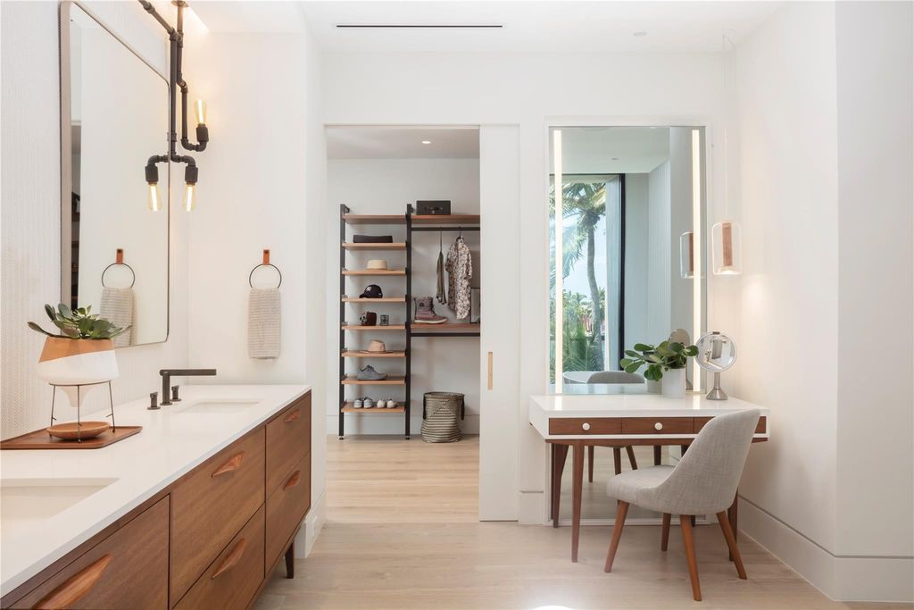 Experience unmatched luxury at 516 Mola Ave, a gated peninsula estate designed by Max Strang and built by Bomar Builders.