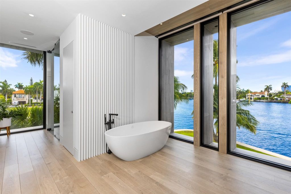 Experience unmatched luxury at 516 Mola Ave, a gated peninsula estate designed by Max Strang and built by Bomar Builders.