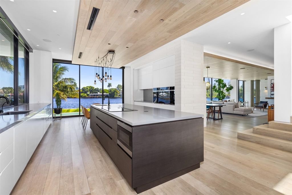 Experience unmatched luxury at 516 Mola Ave, a gated peninsula estate designed by Max Strang and built by Bomar Builders.