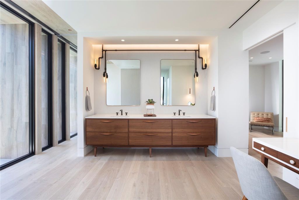 Experience unmatched luxury at 516 Mola Ave, a gated peninsula estate designed by Max Strang and built by Bomar Builders.