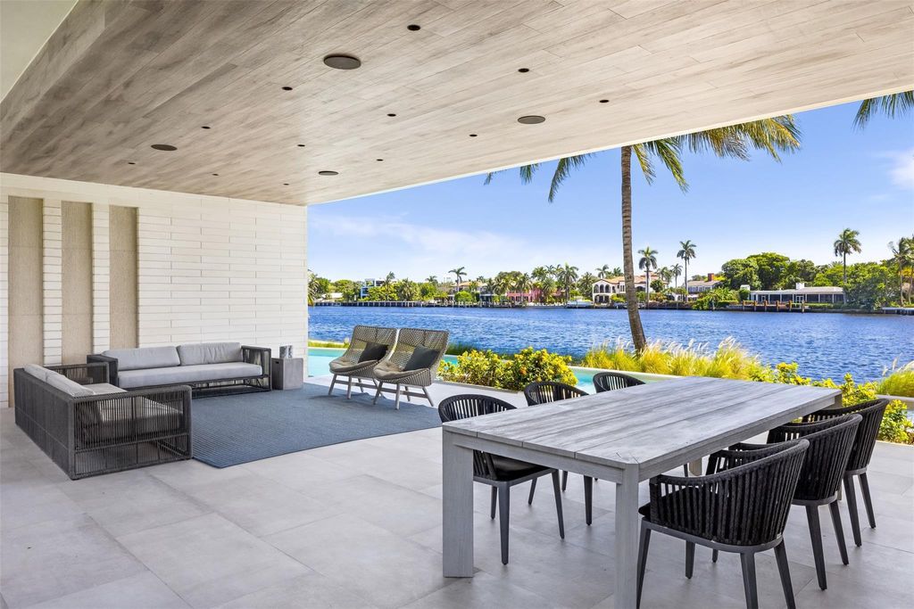 Experience unmatched luxury at 516 Mola Ave, a gated peninsula estate designed by Max Strang and built by Bomar Builders.
