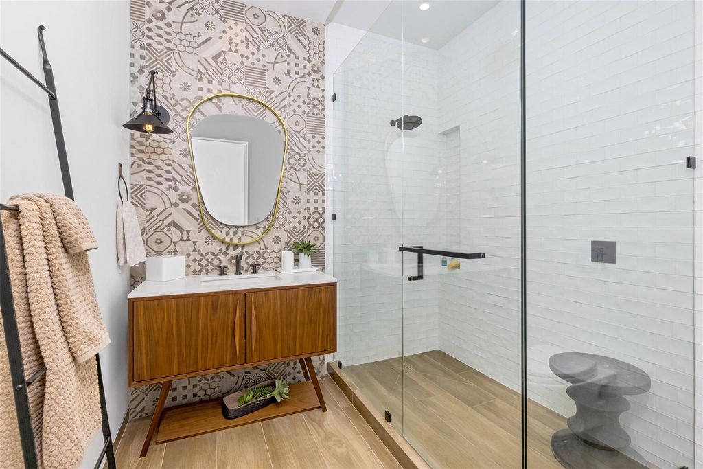 Experience unmatched luxury at 516 Mola Ave, a gated peninsula estate designed by Max Strang and built by Bomar Builders.