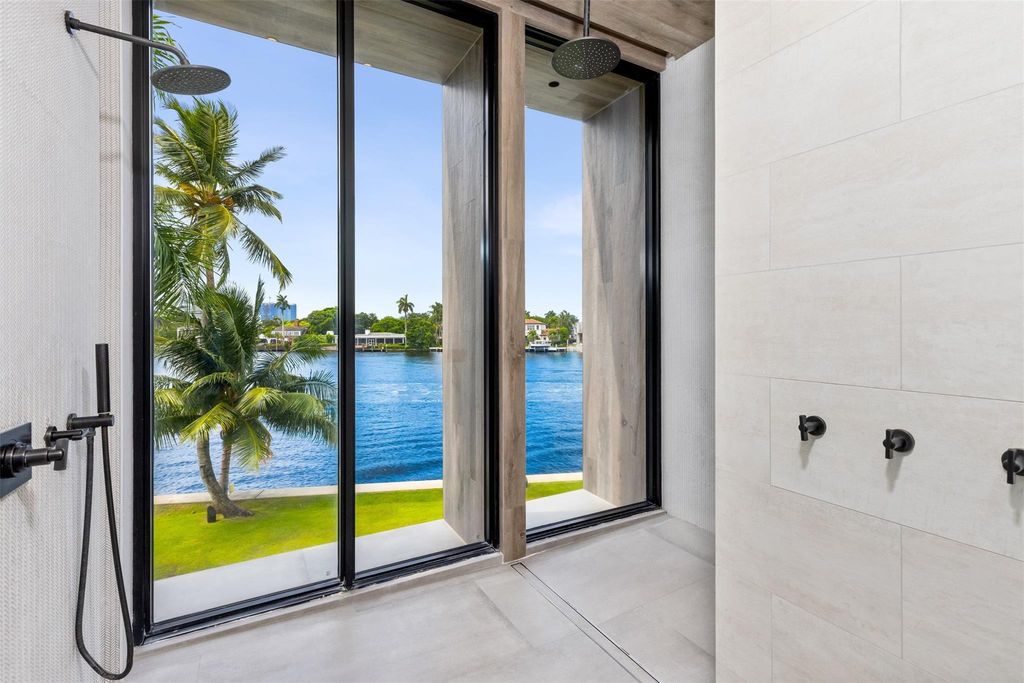 Experience unmatched luxury at 516 Mola Ave, a gated peninsula estate designed by Max Strang and built by Bomar Builders.