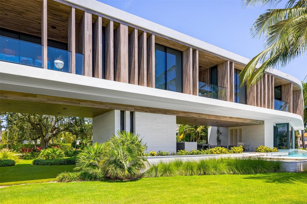 Experience unmatched luxury at 516 Mola Ave, a gated peninsula estate designed by Max Strang and built by Bomar Builders.