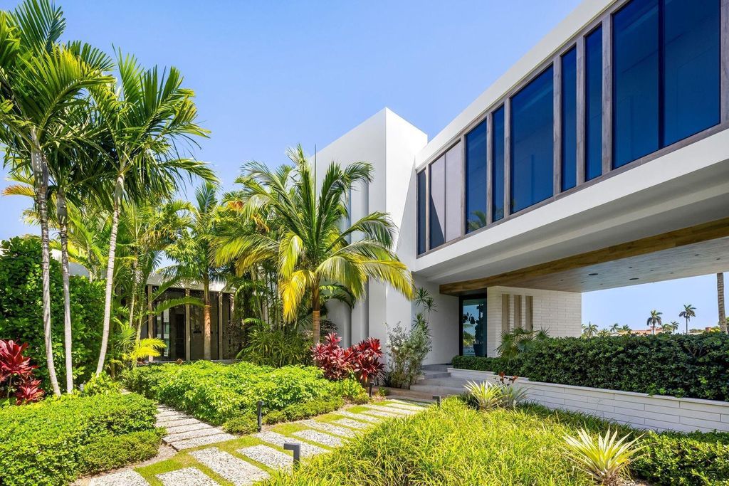 Experience unmatched luxury at 516 Mola Ave, a gated peninsula estate designed by Max Strang and built by Bomar Builders.