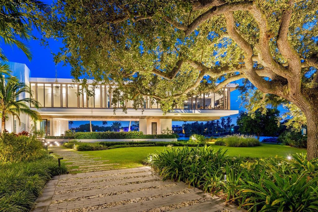 Experience unmatched luxury at 516 Mola Ave, a gated peninsula estate designed by Max Strang and built by Bomar Builders.