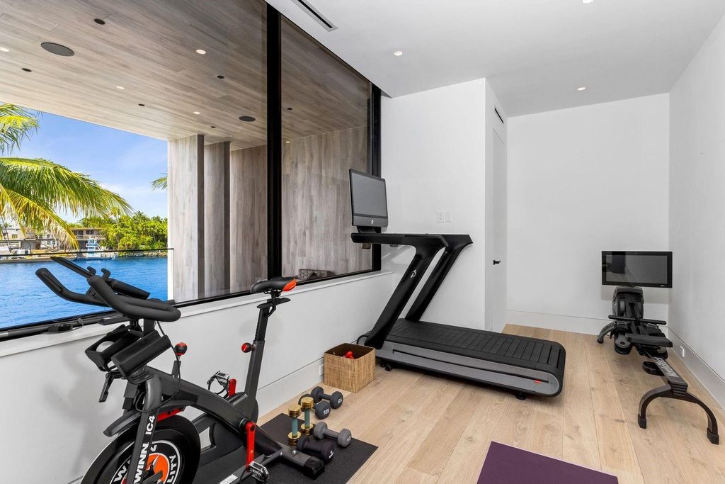 Experience unmatched luxury at 516 Mola Ave, a gated peninsula estate designed by Max Strang and built by Bomar Builders.