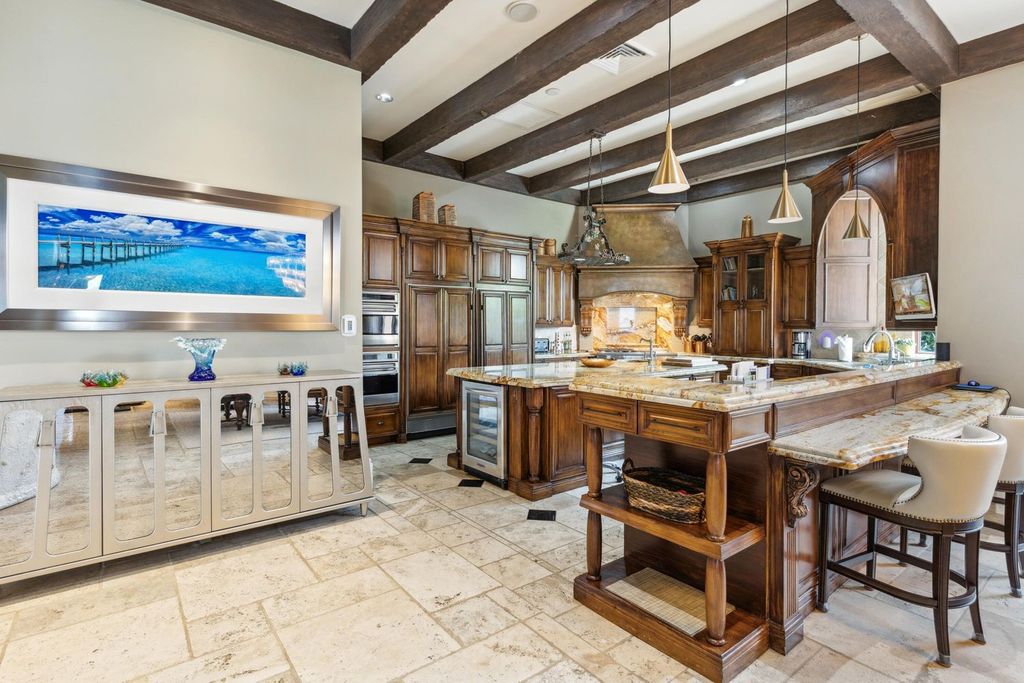 Featured on HGTV's Extreme Homes, this Tuscan-inspired masterpiece sits on a sprawling 1.87-acre lot, boasting over 400 feet of stunning water frontage along Choctawhatchee Bay and Jones Bayou.