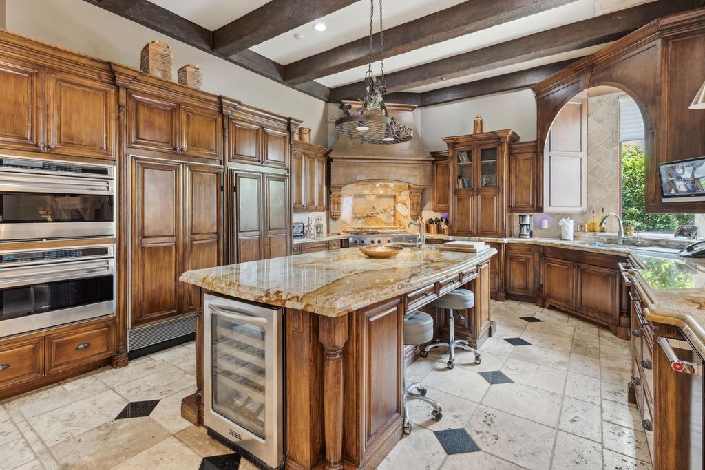 Featured on HGTV's Extreme Homes, this Tuscan-inspired masterpiece sits on a sprawling 1.87-acre lot, boasting over 400 feet of stunning water frontage along Choctawhatchee Bay and Jones Bayou.