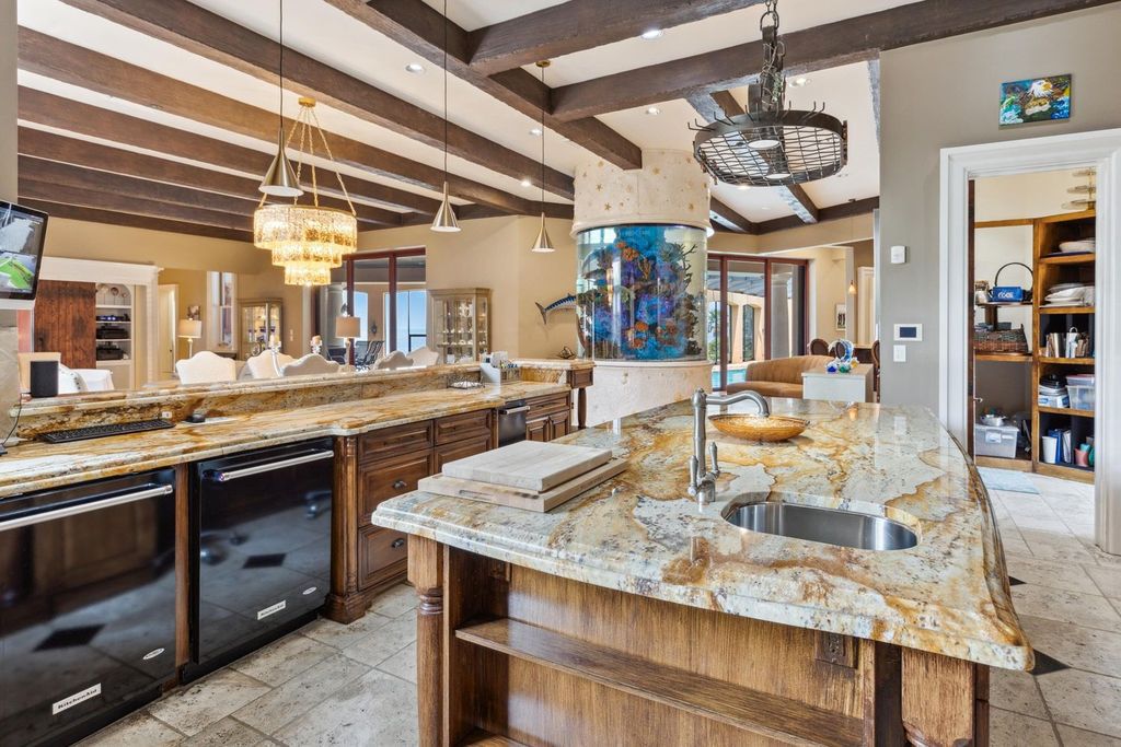 Featured on HGTV's Extreme Homes, this Tuscan-inspired masterpiece sits on a sprawling 1.87-acre lot, boasting over 400 feet of stunning water frontage along Choctawhatchee Bay and Jones Bayou.