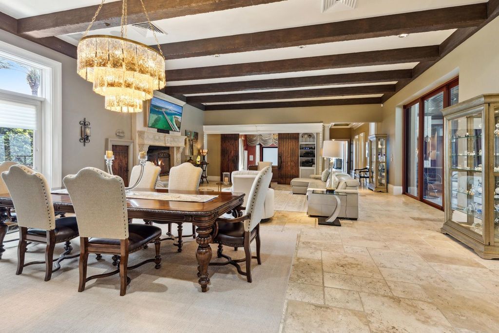 Featured on HGTV's Extreme Homes, this Tuscan-inspired masterpiece sits on a sprawling 1.87-acre lot, boasting over 400 feet of stunning water frontage along Choctawhatchee Bay and Jones Bayou.