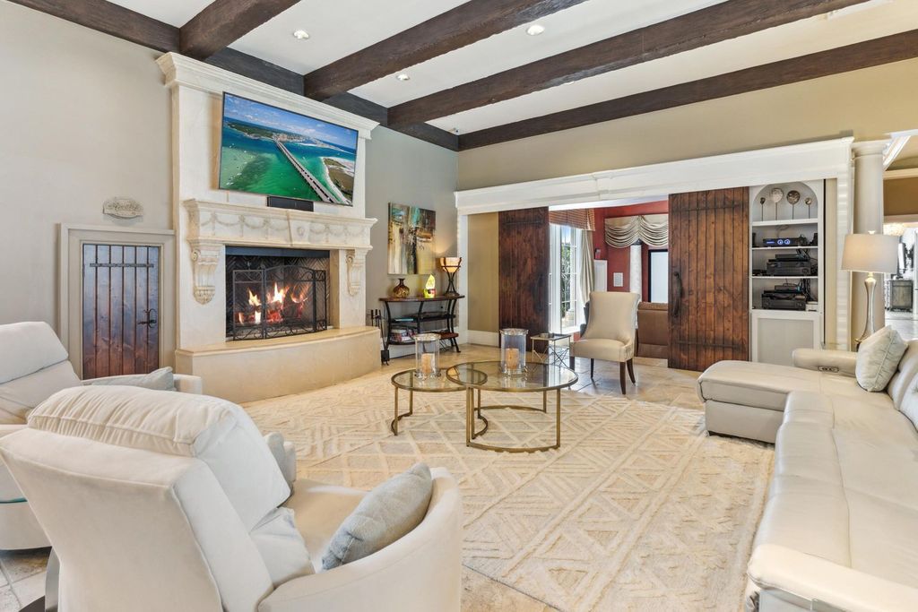 Featured on HGTV's Extreme Homes, this Tuscan-inspired masterpiece sits on a sprawling 1.87-acre lot, boasting over 400 feet of stunning water frontage along Choctawhatchee Bay and Jones Bayou.