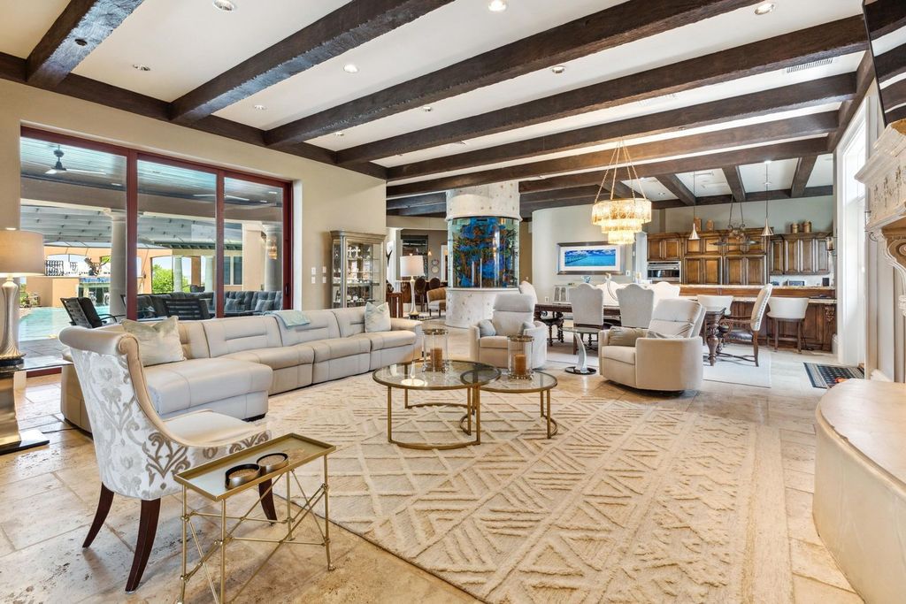 Featured on HGTV's Extreme Homes, this Tuscan-inspired masterpiece sits on a sprawling 1.87-acre lot, boasting over 400 feet of stunning water frontage along Choctawhatchee Bay and Jones Bayou.