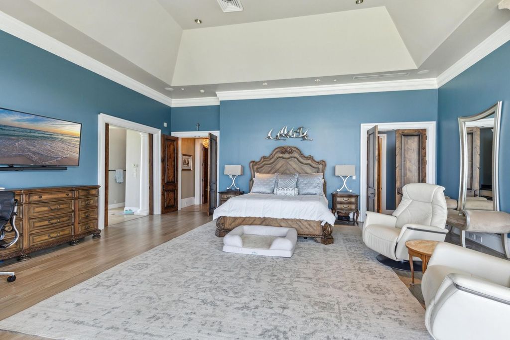 Featured on HGTV's Extreme Homes, this Tuscan-inspired masterpiece sits on a sprawling 1.87-acre lot, boasting over 400 feet of stunning water frontage along Choctawhatchee Bay and Jones Bayou.
