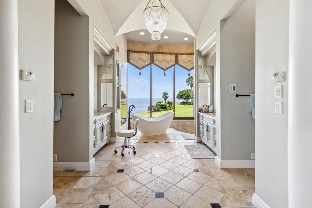 Featured on HGTV's Extreme Homes, this Tuscan-inspired masterpiece sits on a sprawling 1.87-acre lot, boasting over 400 feet of stunning water frontage along Choctawhatchee Bay and Jones Bayou.