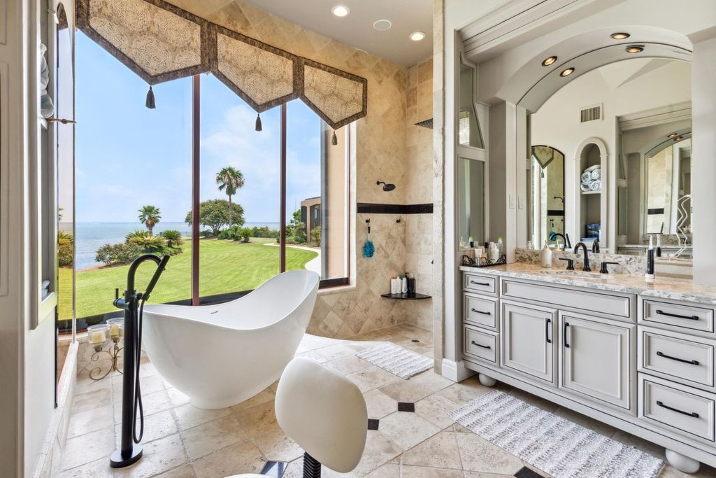 Featured on HGTV's Extreme Homes, this Tuscan-inspired masterpiece sits on a sprawling 1.87-acre lot, boasting over 400 feet of stunning water frontage along Choctawhatchee Bay and Jones Bayou.
