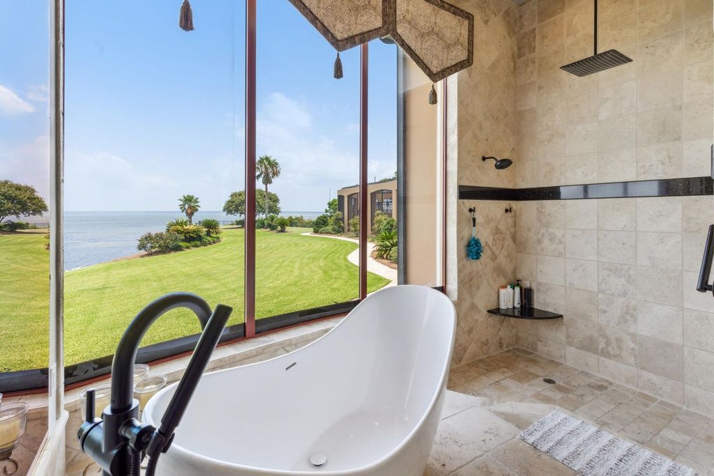 Featured on HGTV's Extreme Homes, this Tuscan-inspired masterpiece sits on a sprawling 1.87-acre lot, boasting over 400 feet of stunning water frontage along Choctawhatchee Bay and Jones Bayou.