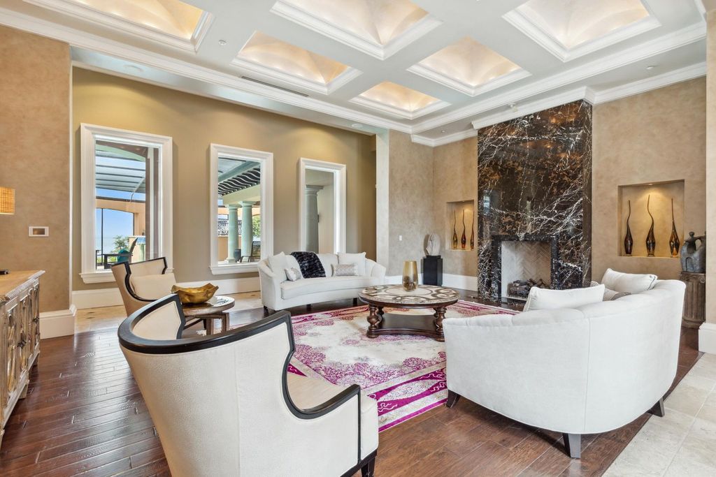 Featured on HGTV's Extreme Homes, this Tuscan-inspired masterpiece sits on a sprawling 1.87-acre lot, boasting over 400 feet of stunning water frontage along Choctawhatchee Bay and Jones Bayou.