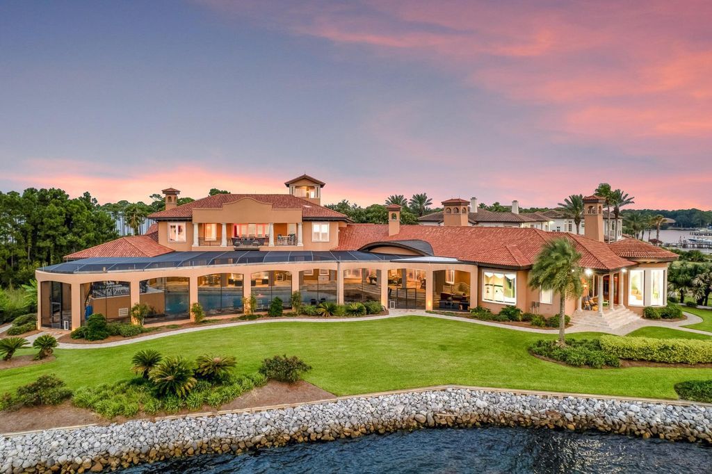 Featured on HGTV's Extreme Homes, this Tuscan-inspired masterpiece sits on a sprawling 1.87-acre lot, boasting over 400 feet of stunning water frontage along Choctawhatchee Bay and Jones Bayou.