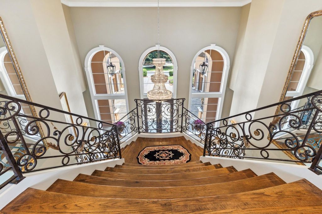 Featured on HGTV's Extreme Homes, this Tuscan-inspired masterpiece sits on a sprawling 1.87-acre lot, boasting over 400 feet of stunning water frontage along Choctawhatchee Bay and Jones Bayou.