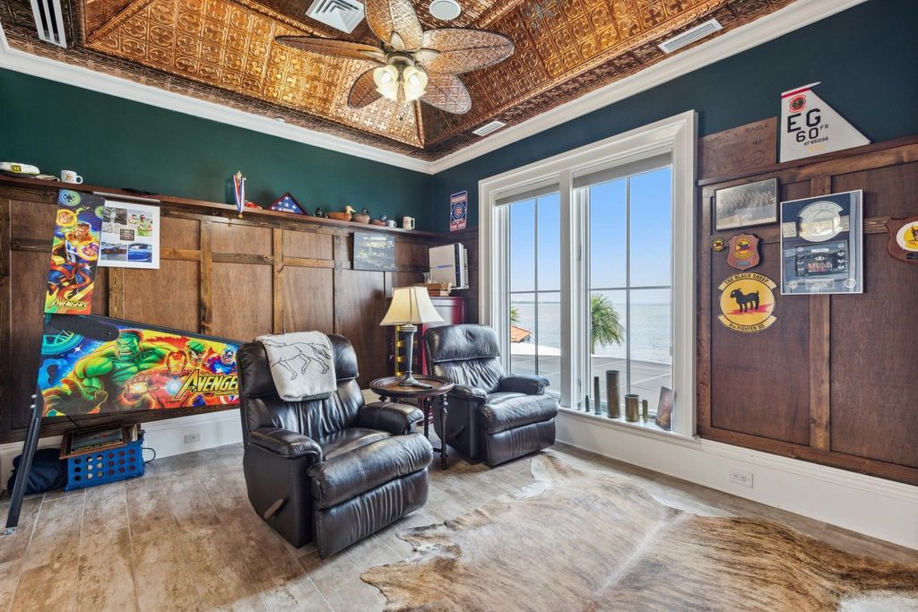 Featured on HGTV's Extreme Homes, this Tuscan-inspired masterpiece sits on a sprawling 1.87-acre lot, boasting over 400 feet of stunning water frontage along Choctawhatchee Bay and Jones Bayou.