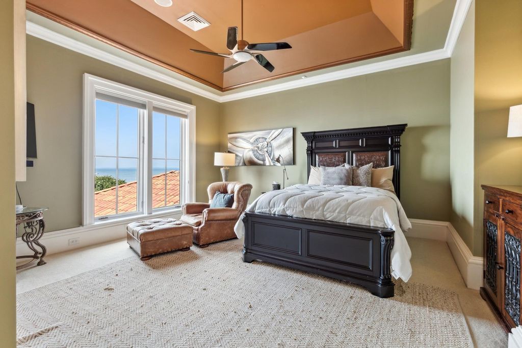Featured on HGTV's Extreme Homes, this Tuscan-inspired masterpiece sits on a sprawling 1.87-acre lot, boasting over 400 feet of stunning water frontage along Choctawhatchee Bay and Jones Bayou.