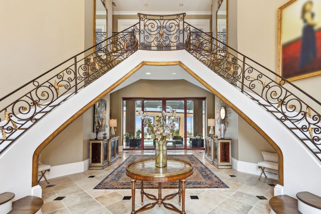 Featured on HGTV's Extreme Homes, this Tuscan-inspired masterpiece sits on a sprawling 1.87-acre lot, boasting over 400 feet of stunning water frontage along Choctawhatchee Bay and Jones Bayou.