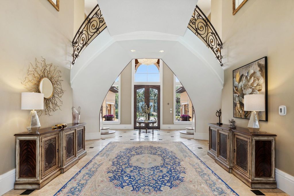 Featured on HGTV's Extreme Homes, this Tuscan-inspired masterpiece sits on a sprawling 1.87-acre lot, boasting over 400 feet of stunning water frontage along Choctawhatchee Bay and Jones Bayou.