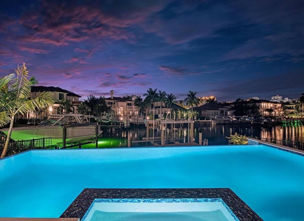 Designed by MHK Architecture and built by T.B. Price Builders, it features an open floor plan that includes a great room, dining area, gourmet kitchen, and a hidden caterer’s kitchen.