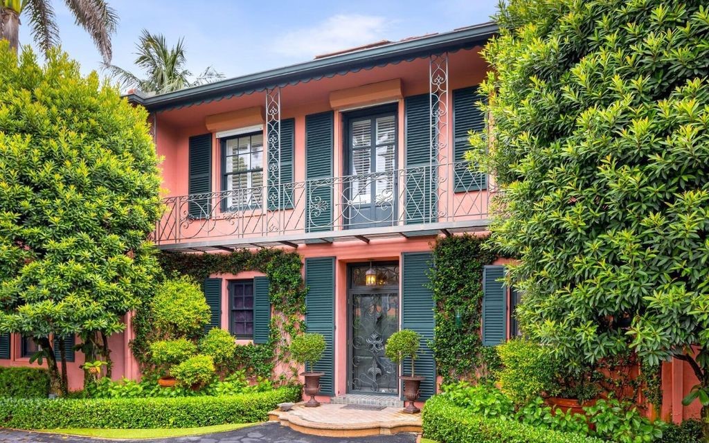 This exceptional 6BR/6.3BA Monterey-Style estate by Howard Major is a rare find on Palm Beach's exclusive El Bravo Way.