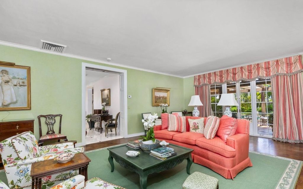 This exceptional 6BR/6.3BA Monterey-Style estate by Howard Major is a rare find on Palm Beach's exclusive El Bravo Way.