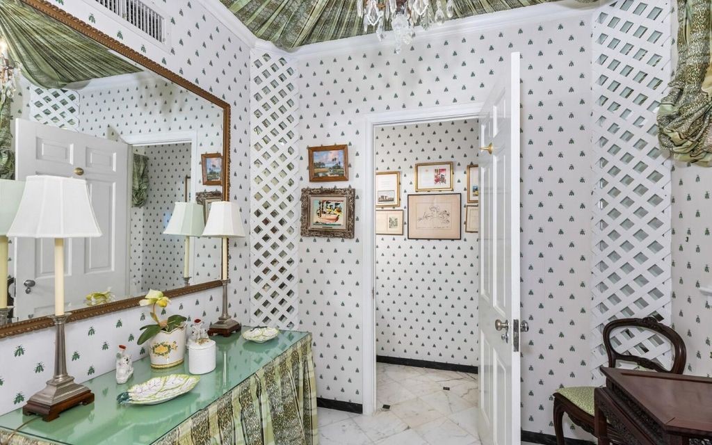 This exceptional 6BR/6.3BA Monterey-Style estate by Howard Major is a rare find on Palm Beach's exclusive El Bravo Way.