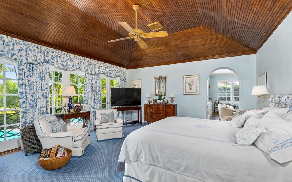 This exceptional 6BR/6.3BA Monterey-Style estate by Howard Major is a rare find on Palm Beach's exclusive El Bravo Way.