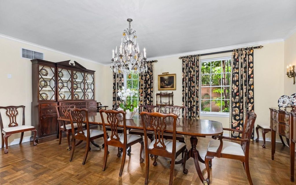 This exceptional 6BR/6.3BA Monterey-Style estate by Howard Major is a rare find on Palm Beach's exclusive El Bravo Way.