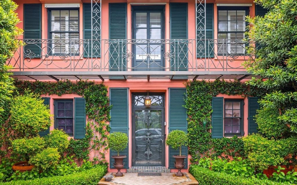 This exceptional 6BR/6.3BA Monterey-Style estate by Howard Major is a rare find on Palm Beach's exclusive El Bravo Way.