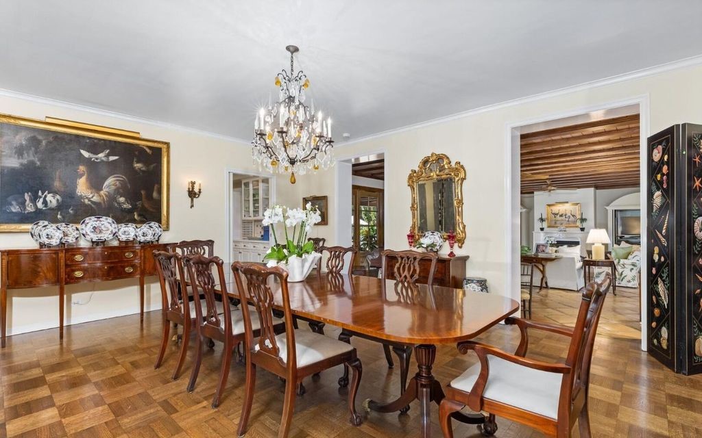 This exceptional 6BR/6.3BA Monterey-Style estate by Howard Major is a rare find on Palm Beach's exclusive El Bravo Way.
