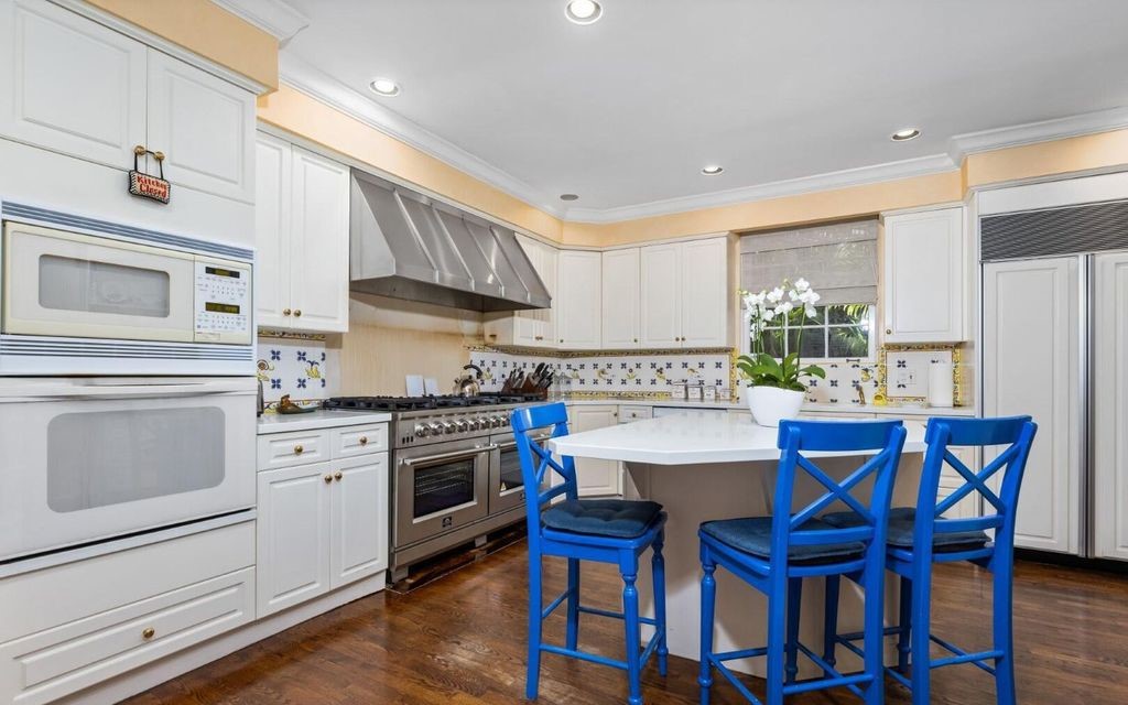 This exceptional 6BR/6.3BA Monterey-Style estate by Howard Major is a rare find on Palm Beach's exclusive El Bravo Way.