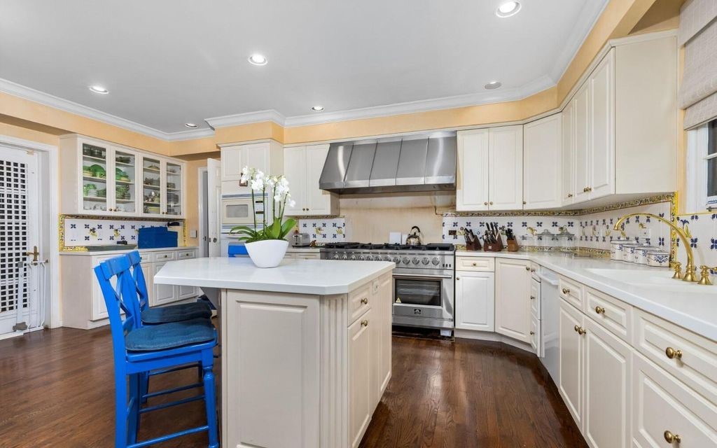 This exceptional 6BR/6.3BA Monterey-Style estate by Howard Major is a rare find on Palm Beach's exclusive El Bravo Way.